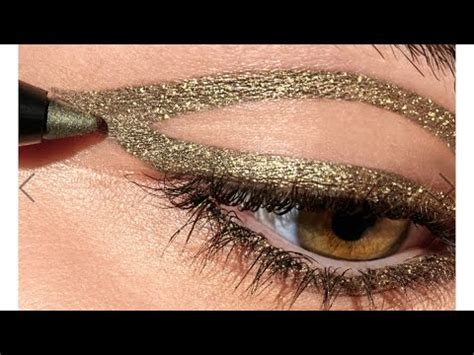 victoria beckham gold lame eyeliner.